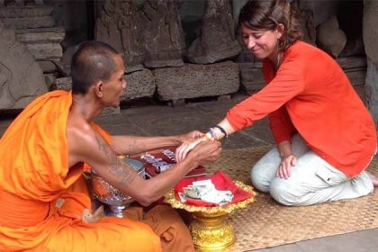 monk blessing in Ang Kor Wat, Cambodia vacations